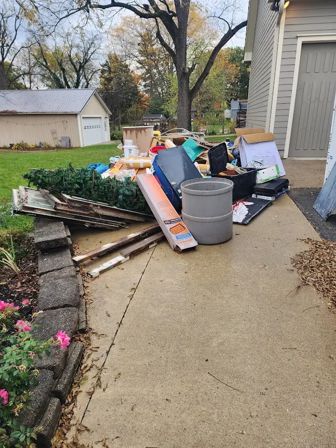Dumpster being loaded with debris for 3 Yard Dumpster Rental in West Odessa